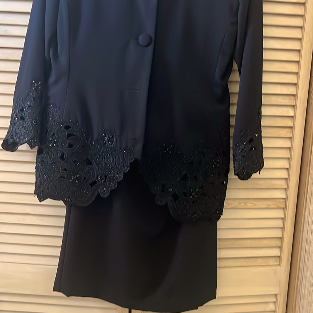 Deep black Skirt Suit . sleeves and bottom part of jacket are beaded size 12